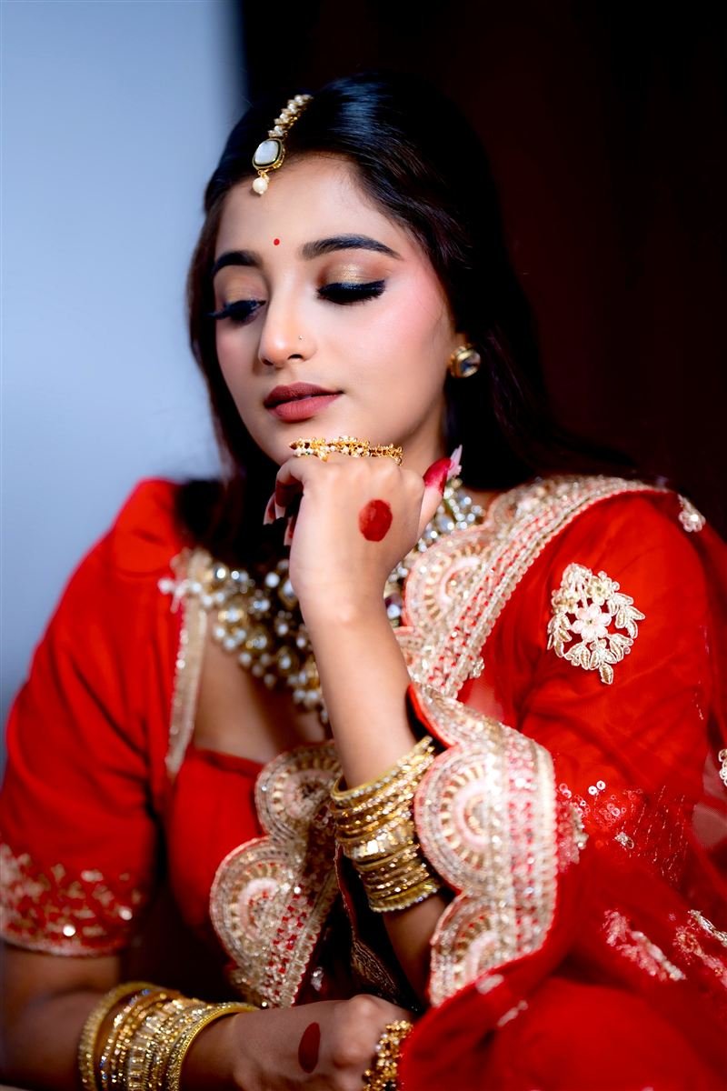 Punjabi bridal makeup, red lehenga with chooda and kundan set — Navi Mumbai